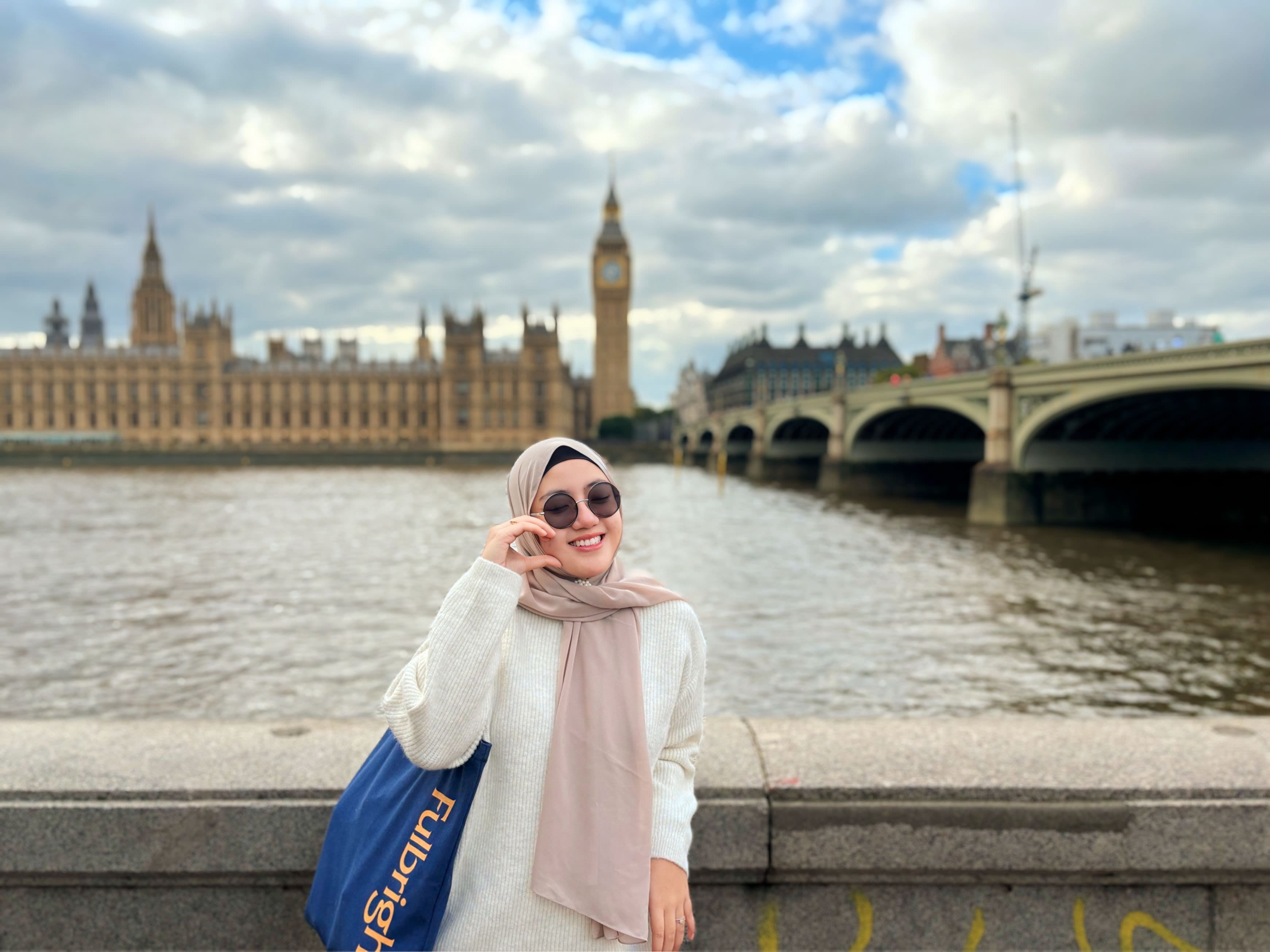 Nava in front of Big Ben, Houses of Parliament and Westminster Bridge in London