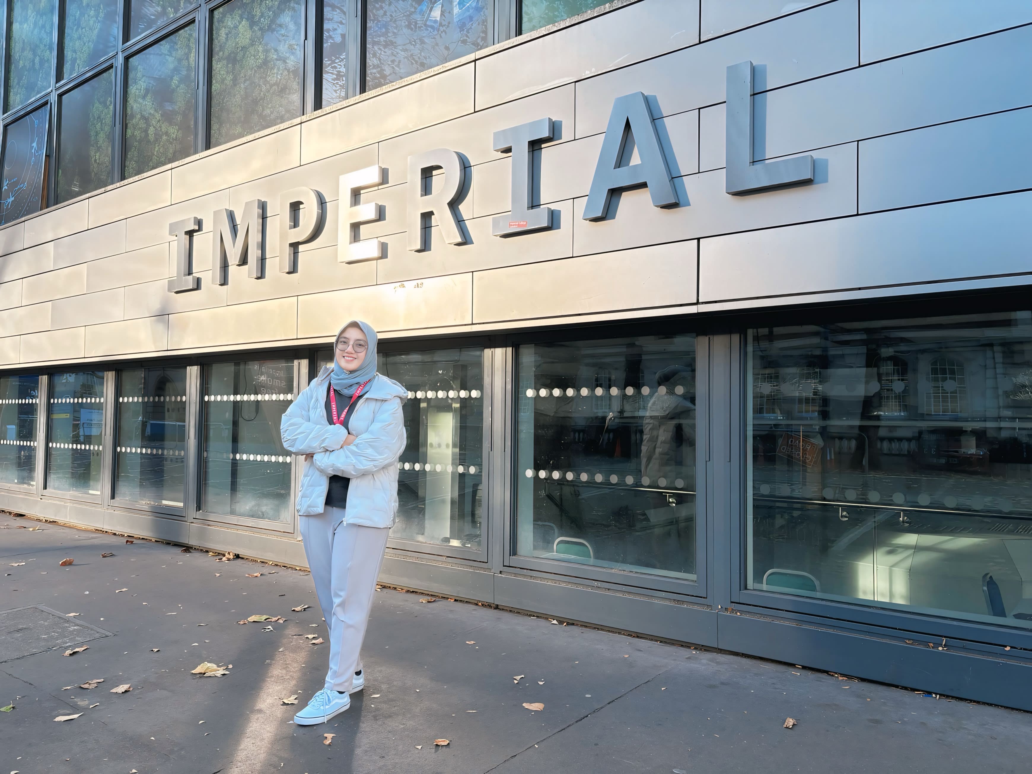 Nava standing outdoors with with a big Imperial logo behind her
