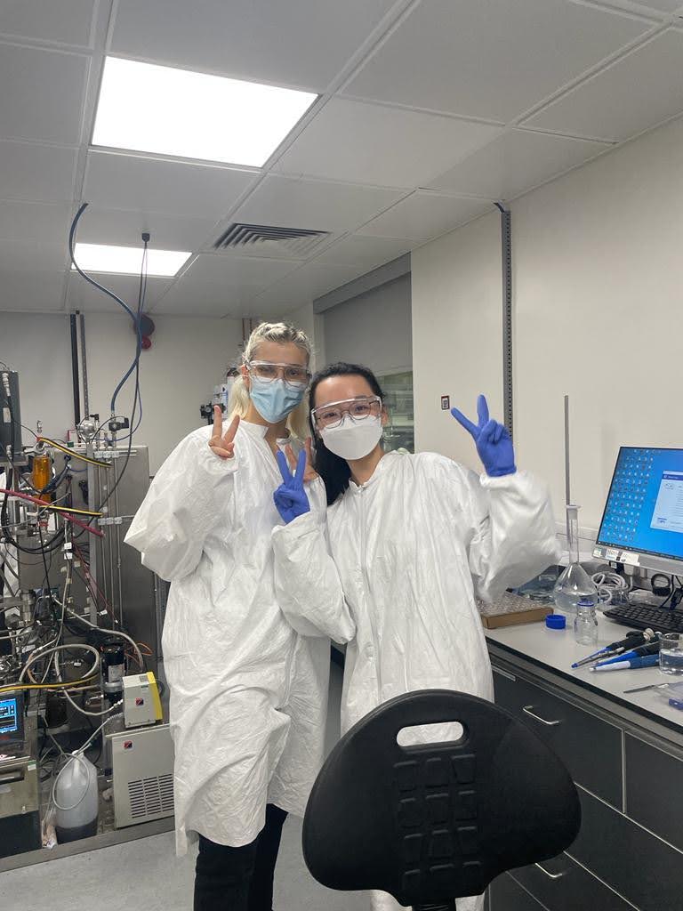 Paulina with a coursemate, dressed in PPE 