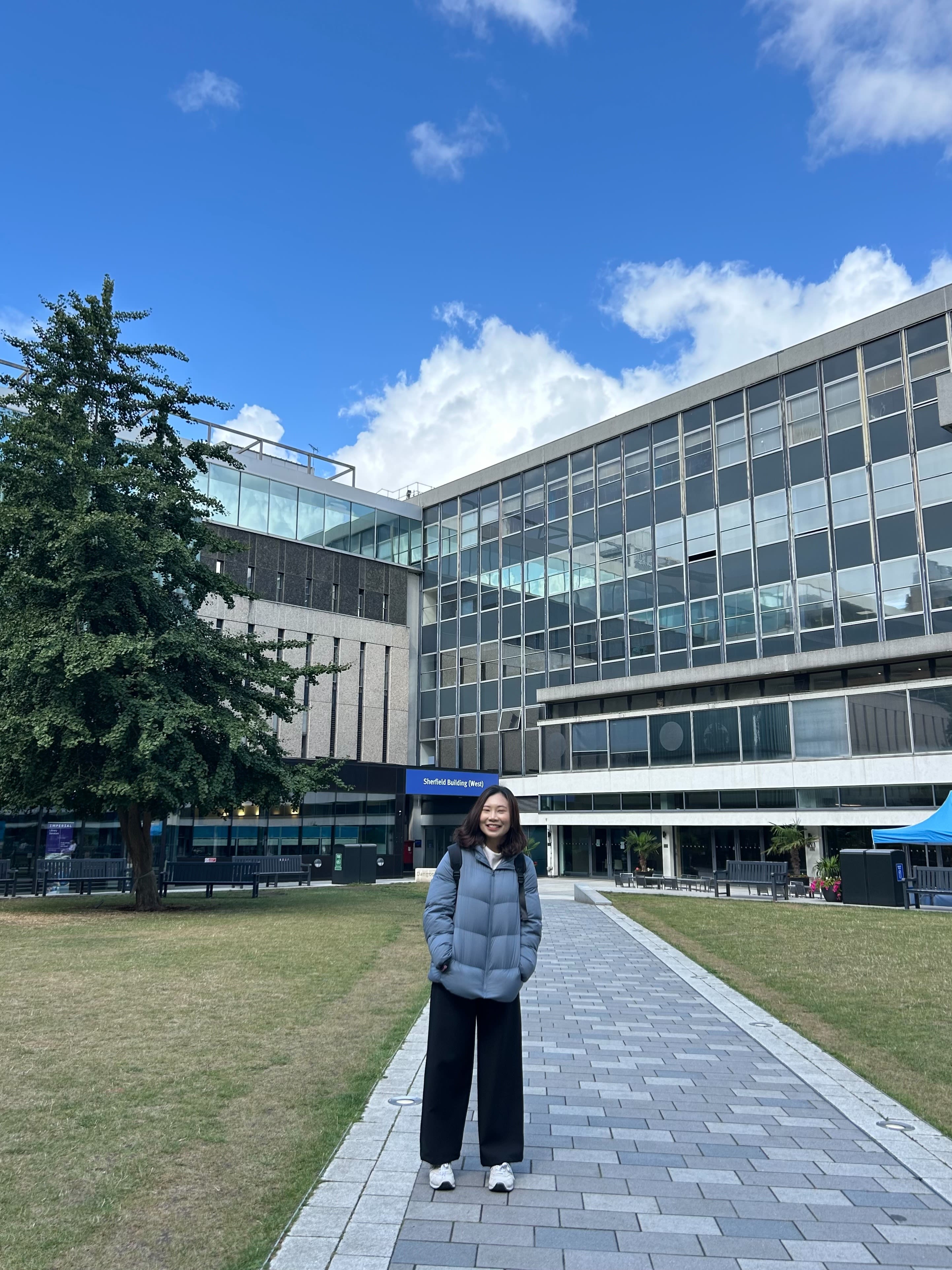 Rose standing on Queen's Lawn on South Kensington Campus