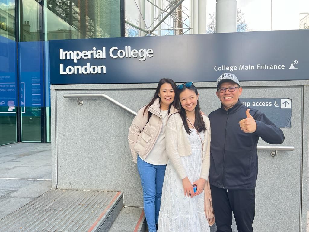 Shermaine and her family outside the main building.