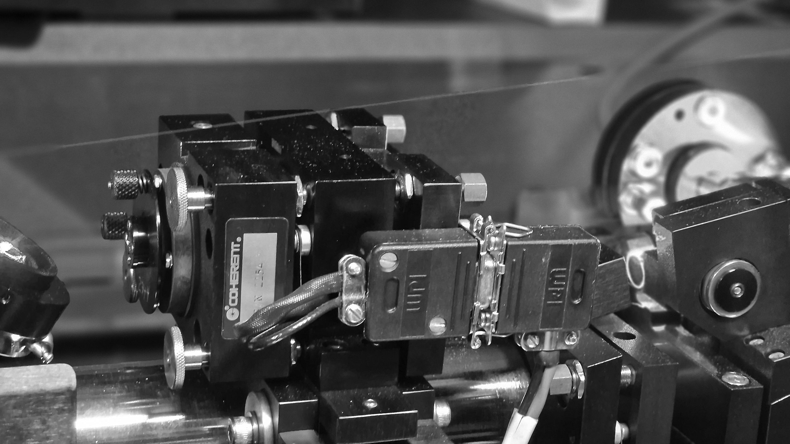 A close-up view of lasers on an optical table