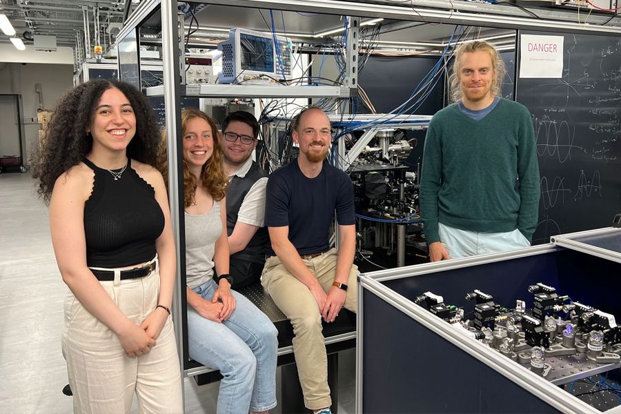 Researchers at Imperial College stand in front of the AION experiment