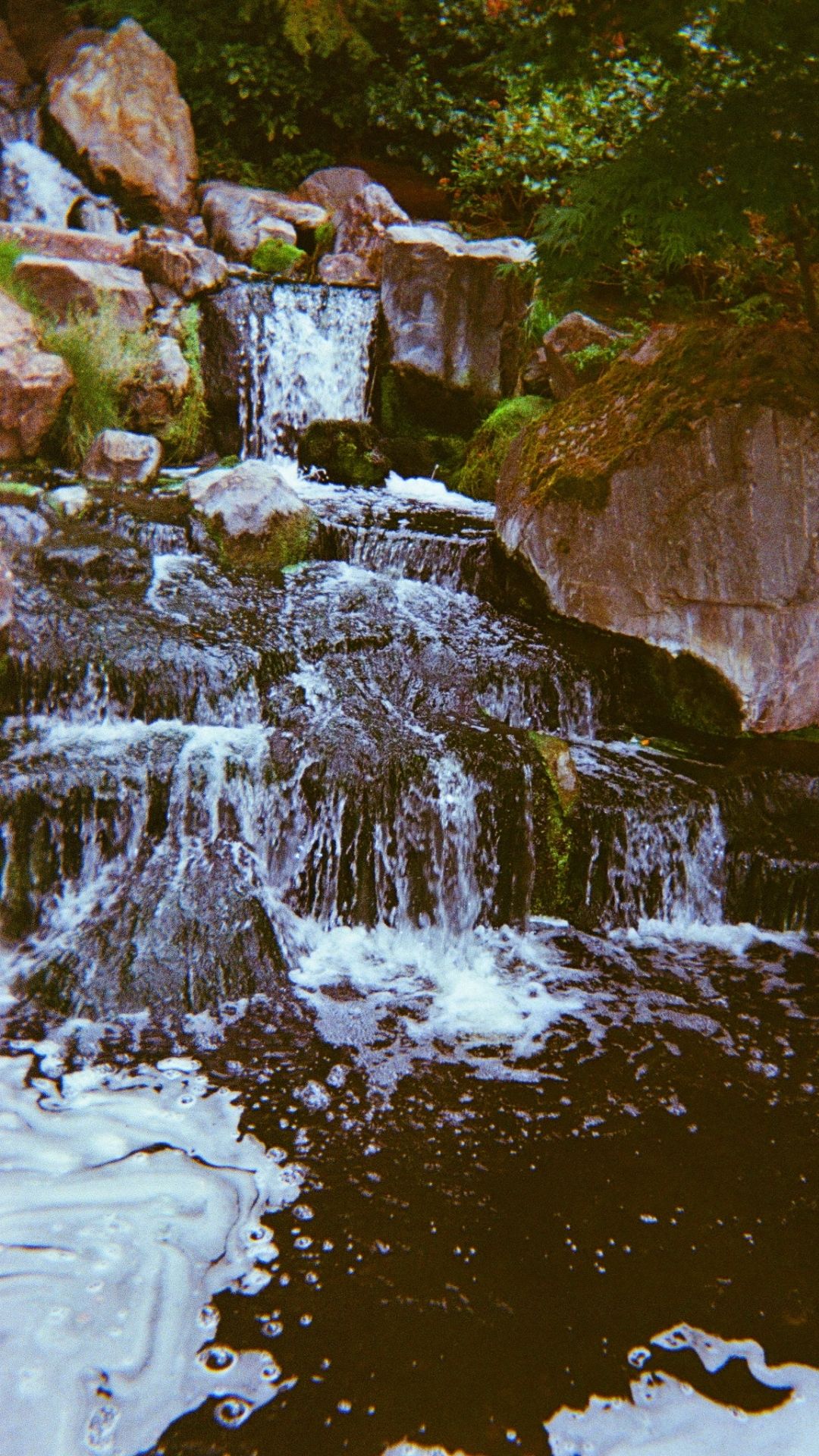 A waterfall and some surrounding rocks.