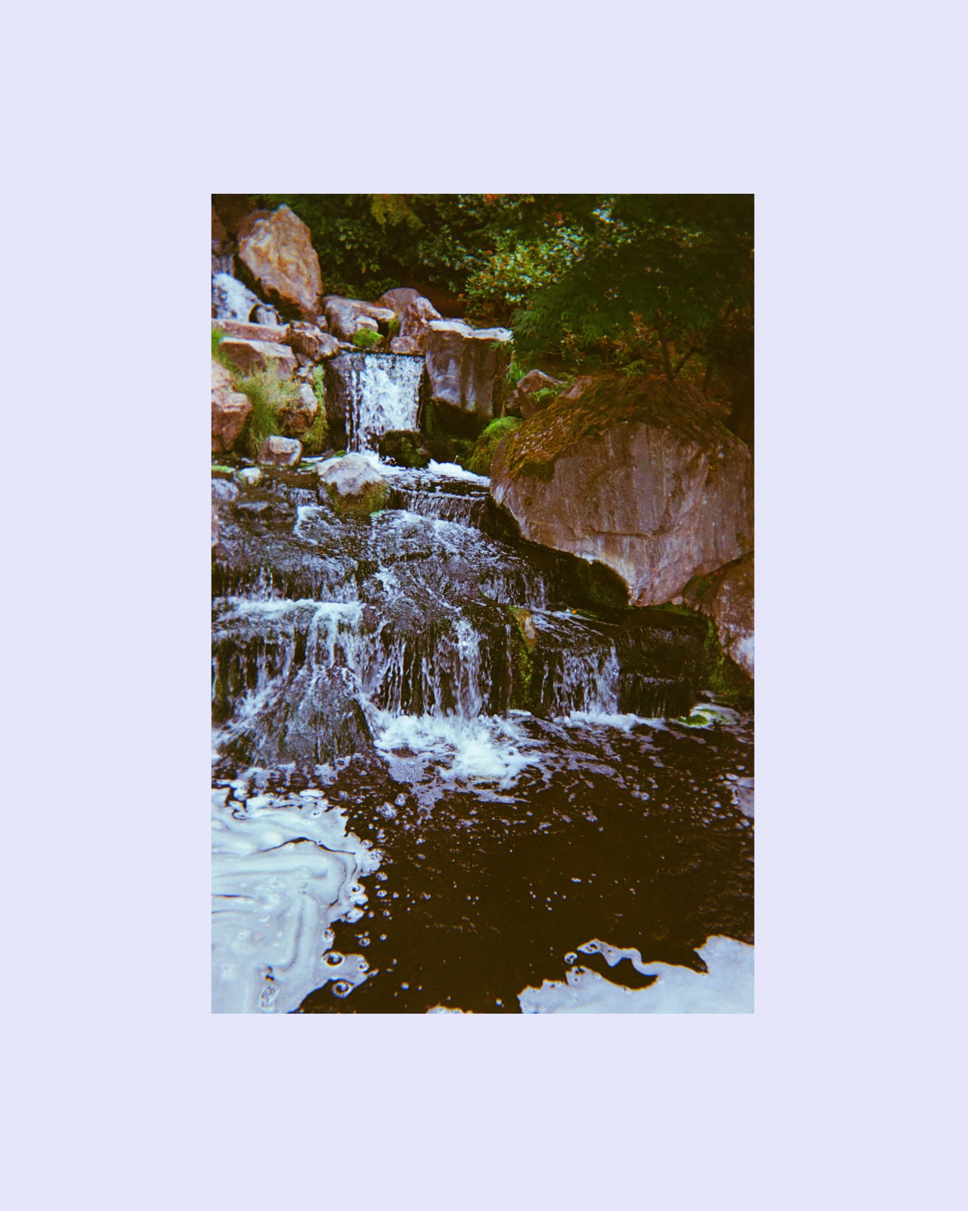 A waterfall and some surrounding rocks.