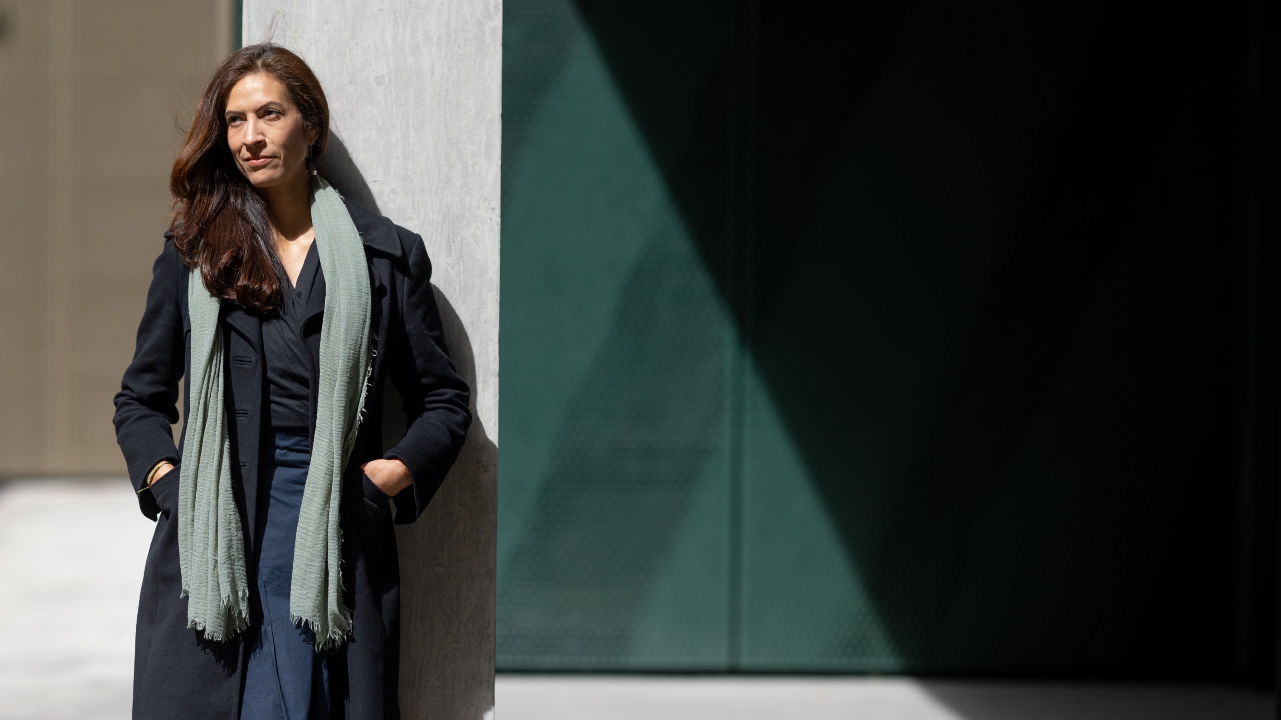 Paula leaning against a pillar 