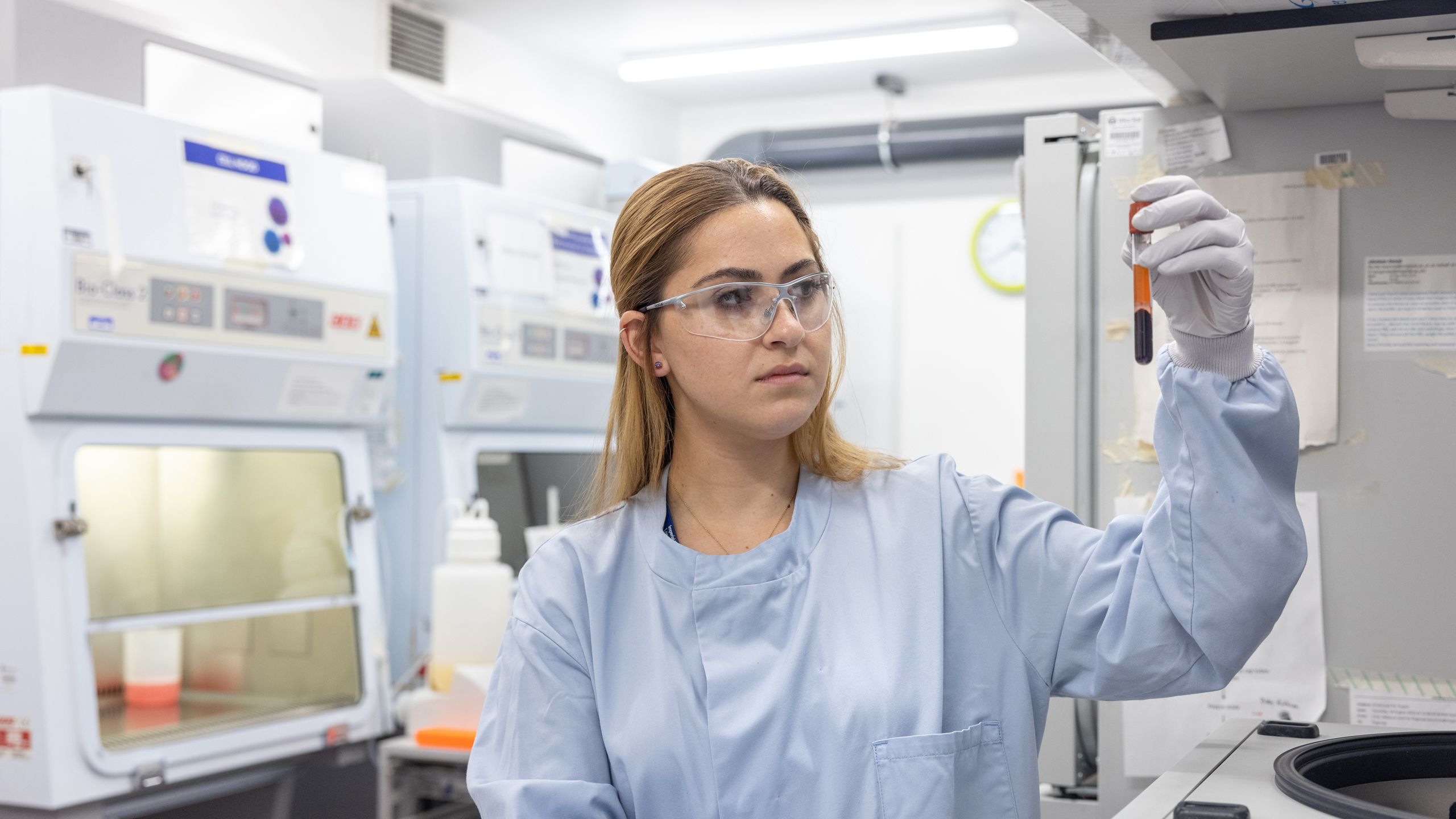 Woman in COVID-19 antibody testing laboratory