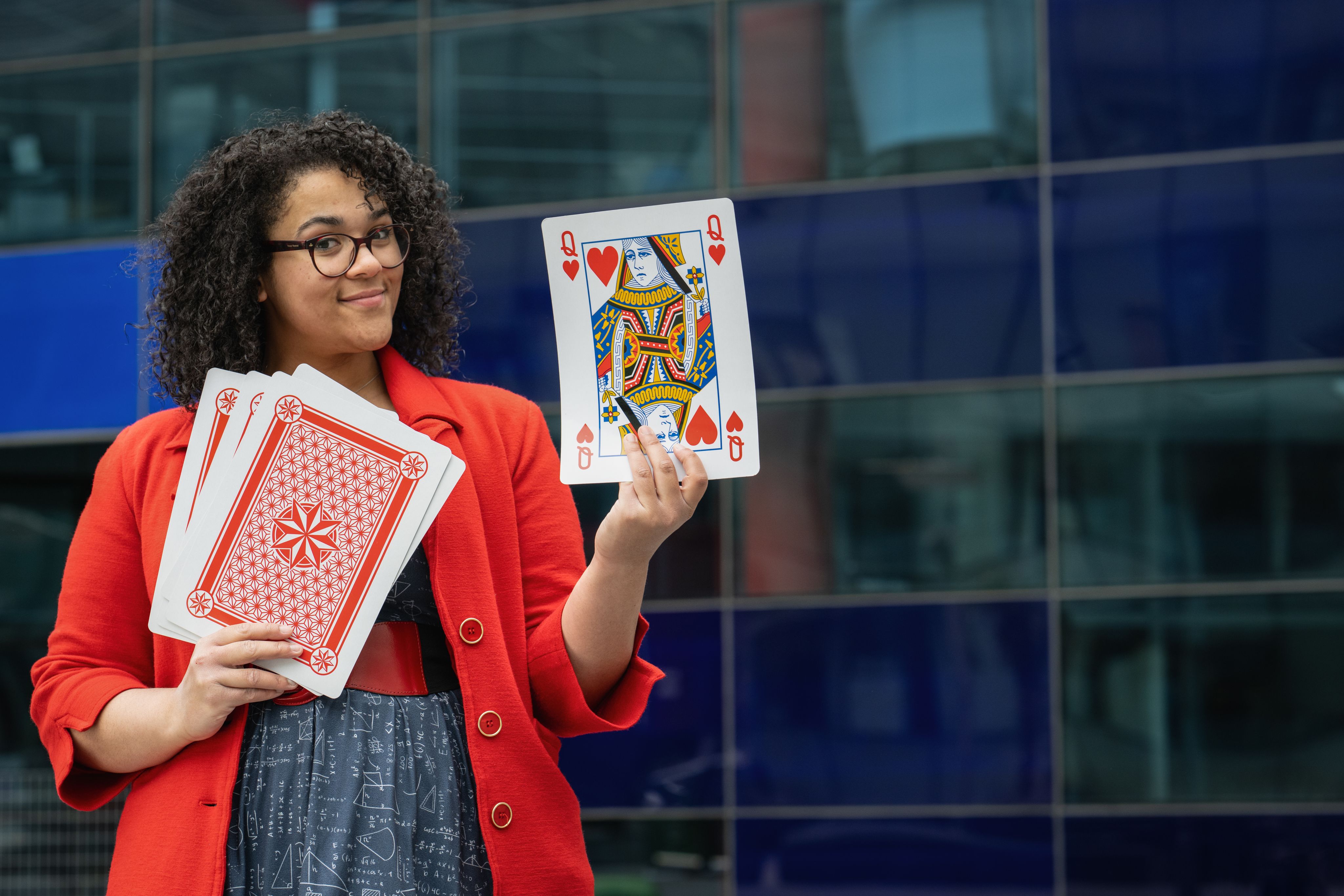 Vanessa holding up the front one of her large playing cards.