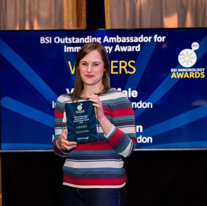 Dr Victoria Male holding her BSI award