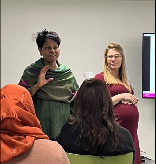 Lena Choudary-Salter and a pregnant Dr Helen Skirrow - giving a presentation