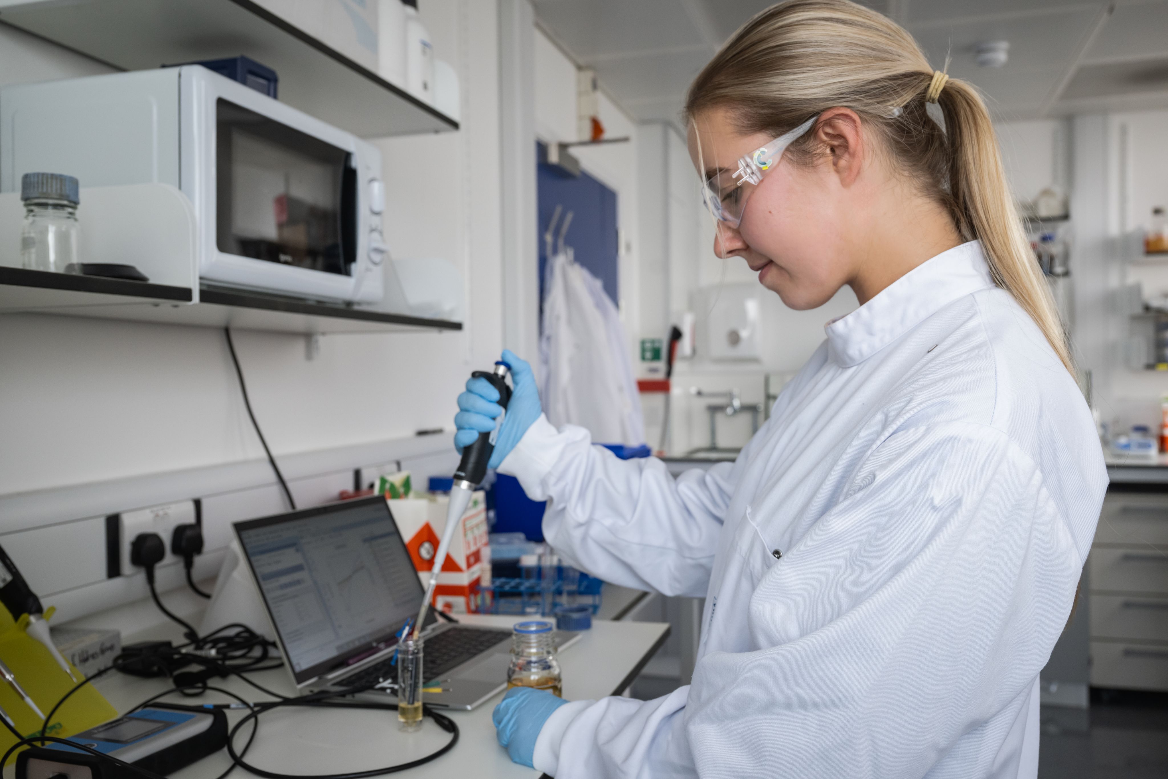 Jenny pipetting in the lab